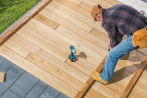 man installing a deck as a DIY project