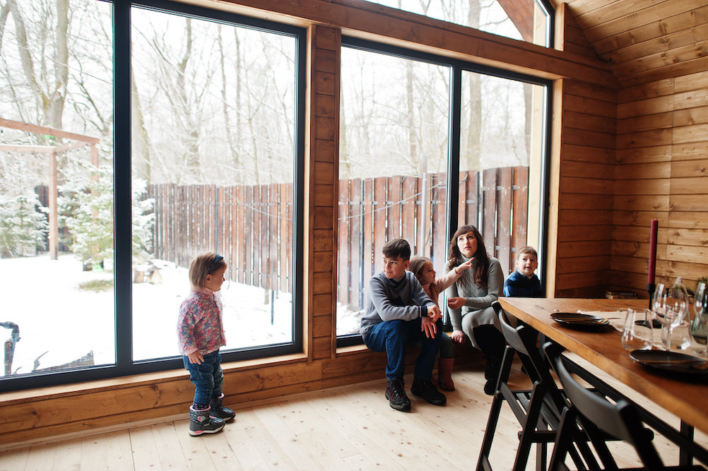 family sitting in front of energy efficient windows