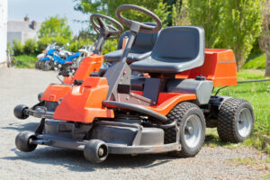 zero turn lawn mowers parked in a row